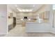 Bright kitchen featuring a built-in oven, center island, and extensive counter space for culinary creations at 8052 Marbella Cir, Las Vegas, NV 89128