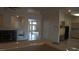 Living room view showcasing an open floor plan, fireplace, and tiled floors, providing seamless flow to other living areas at 8052 Marbella Cir, Las Vegas, NV 89128