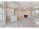 Open-concept living space features tile floors, bar seating, fireplace, and welcoming entryway at 8052 Marbella Cir, Las Vegas, NV 89128