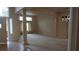Open living room with neutral carpet, chandelier and elegant columns showcasing a spacious layout at 8052 Marbella Cir, Las Vegas, NV 89128