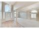 Bright living room with high ceilings, chandelier, and large windows offering plenty of natural light at 8052 Marbella Cir, Las Vegas, NV 89128