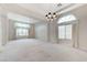 Bright living room with coffered ceilings, large windows, and elegant drapery creating an inviting atmosphere at 8052 Marbella Cir, Las Vegas, NV 89128