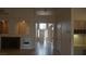Wide shot of open concept living area, fireplace, and an entryway leading to dining area providing a great flow at 8052 Marbella Cir, Las Vegas, NV 89128