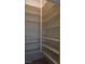 Walk-in pantry with multiple shelves for organized storage at 8052 Marbella Cir, Las Vegas, NV 89128