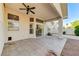 Covered patio with tile flooring and desert-style landscaping at 8052 Marbella Cir, Las Vegas, NV 89128