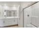 Modern bathroom features double sinks, quartz countertops and tiled shower at 816 Sand Camel Ct, North Las Vegas, NV 89081