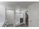 Well-lit bathroom with a sleek glass-enclosed shower, updated fixtures, and access to a walk-in closet at 816 Sand Camel Ct, North Las Vegas, NV 89081