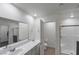 Clean and modern bathroom with dual sinks, ample counter space, and a glass-enclosed shower for a refreshing experience at 816 Sand Camel Ct, North Las Vegas, NV 89081