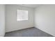 Cozy bedroom featuring neutral carpet, white walls, and a window with blinds at 816 Sand Camel Ct, North Las Vegas, NV 89081