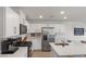 Bright kitchen with white cabinets, stainless steel appliances, and a quartz countertop island at 816 Sand Camel Ct, North Las Vegas, NV 89081