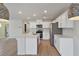 Modern kitchen features stainless steel appliances, quartz countertops, and a large island at 816 Sand Camel Ct, North Las Vegas, NV 89081
