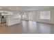 Bright, open-concept living space features wood floors, modern lighting, and access to backyard at 816 Sand Camel Ct, North Las Vegas, NV 89081