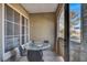 Cozy balcony featuring a glass table, four chairs, and views of the outdoors at 9000 S Las Vegas Blvd # 2222, Las Vegas, NV 89123