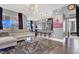 Open-concept living space with kitchen, dining area, and modern lighting, complete with comfortable seating at 9000 S Las Vegas Blvd # 2222, Las Vegas, NV 89123