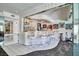 Entertaining bar area with tile floors, custom lighting, and ample seating at 940 Vegas Valley Dr, Las Vegas, NV 89109