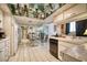 Spacious kitchen with unique mirrored ceiling, modern appliances, and a stylish dining area for gatherings at 940 Vegas Valley Dr, Las Vegas, NV 89109