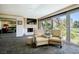 Living room with fireplace, large windows and golf course view at 940 Vegas Valley Dr, Las Vegas, NV 89109