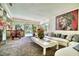 Spacious living room with stylish furniture, carpet, and large windows overlooking the pool at 940 Vegas Valley Dr, Las Vegas, NV 89109