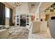 Cozy living room featuring carpet, high ceilings, tile floor, and abundant natural light at 940 Vegas Valley Dr, Las Vegas, NV 89109