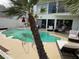 Private pool with a relaxing lounge area and a view of the lush backyard at 940 Vegas Valley Dr, Las Vegas, NV 89109