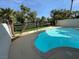 Inviting pool with pristine blue water is surrounded by lush palm trees, great for entertaining at 940 Vegas Valley Dr, Las Vegas, NV 89109