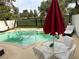 This backyard features a crystal-clear pool, patio furniture, and ample space for entertaining at 940 Vegas Valley Dr, Las Vegas, NV 89109
