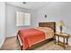 Bedroom with wood-look flooring, bright, neutral walls, and a window at 9588 Comiskey Ct, Las Vegas, NV 89148