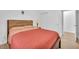 Bedroom with wood-look flooring and bright, neutral walls at 9588 Comiskey Ct, Las Vegas, NV 89148