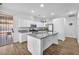 Updated kitchen featuring white cabinets, granite countertops, and stainless steel appliances at 9588 Comiskey Ct, Las Vegas, NV 89148