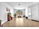 Bright living room with laminate floors, large window, and neutral color scheme at 9588 Comiskey Ct, Las Vegas, NV 89148
