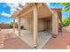 Shaded patio with access to the backyard, providing a comfortable and relaxing outdoor space at 9588 Comiskey Ct, Las Vegas, NV 89148