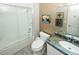 Bathroom featuring granite counters, shower over tub, and ample lighting at 9858 Gemstone Sunset Ave, Las Vegas, NV 89148