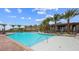 A resort-style community pool surrounded by palm trees offers a refreshing oasis for residents to enjoy at 9858 Gemstone Sunset Ave, Las Vegas, NV 89148