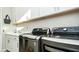 Well-equipped laundry area featuring modern appliances and ample counter space at 9858 Gemstone Sunset Ave, Las Vegas, NV 89148