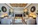 Stylish lounge area featuring comfortable seating, modern decor, and a cozy fireplace for relaxing and socializing at 9858 Gemstone Sunset Ave, Las Vegas, NV 89148