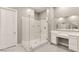 This bright bathroom offers a large step-in shower and a vanity area at 10086 Mountain Foothills Ave, Las Vegas, NV 89149