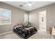 Bedroom featuring two windows with shutters and neutral colored walls at 10086 Mountain Foothills Ave, Las Vegas, NV 89149