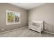 Neutral Bedroom with carpet, window with shutters, and a white crib at 10086 Mountain Foothills Ave, Las Vegas, NV 89149