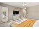 A bright bedroom features an entertainment center and direct access to the outside at 10086 Mountain Foothills Ave, Las Vegas, NV 89149