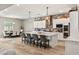 Well-appointed kitchen featuring a large island, stainless steel appliances, and open access to the dining area at 10086 Mountain Foothills Ave, Las Vegas, NV 89149
