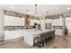 Bright kitchen with a large center island, stainless steel appliances, and elegant pendant lighting at 10086 Mountain Foothills Ave, Las Vegas, NV 89149