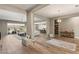 Bright, airy living space featuring an open layout, wood-look floors, and seamless flow into adjacent rooms at 10086 Mountain Foothills Ave, Las Vegas, NV 89149