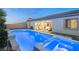 Heated backyard pool and spa with covered patio at 10086 Mountain Foothills Ave, Las Vegas, NV 89149