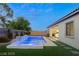 Backyard pool and hot tub with synthetic lawn at 10086 Mountain Foothills Ave, Las Vegas, NV 89149