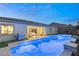 Backyard pool and hot tub with covered patio at 10086 Mountain Foothills Ave, Las Vegas, NV 89149