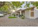 Backyard with an outdoor seating area and desert landscaping at 10309 Broom Hill Dr, Las Vegas, NV 89134
