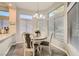 Charming breakfast nook bathed in natural light, featuring a cozy round table and window views at 10309 Broom Hill Dr, Las Vegas, NV 89134