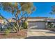 Charming single-story home featuring a two-car garage and mature landscaping in a desirable neighborhood at 10309 Broom Hill Dr, Las Vegas, NV 89134