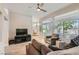 Comfortable living room with backyard access and great natural light flowing into the dining area at 10309 Broom Hill Dr, Las Vegas, NV 89134
