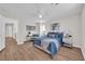 Carpet free primary bedroom with a ceiling fan and ensuite bathroom at 11164 African Sunset St, Henderson, NV 89052
